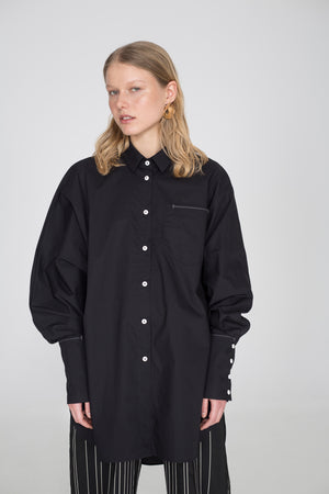 Oversized black shirt with one wide sleeve